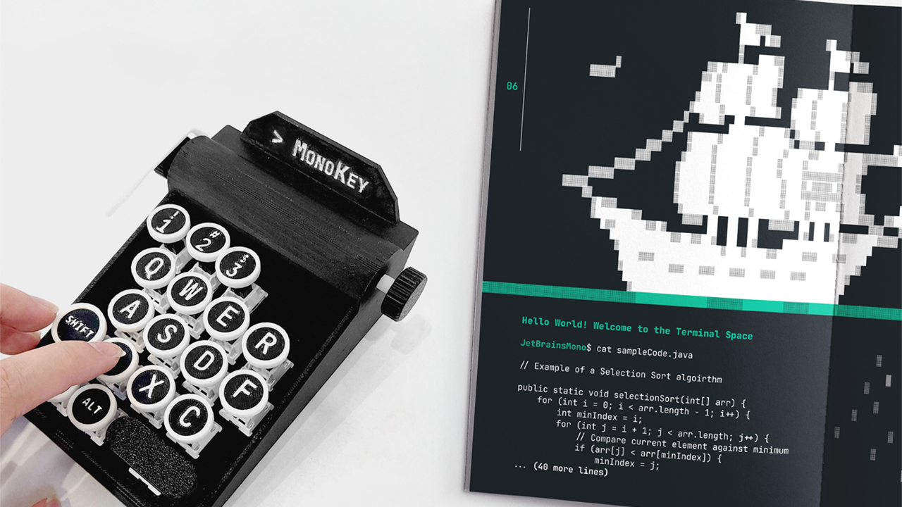 Miniature typewriter artifact alongside a type specimen booklet featuring ASCII art of a pirate ship
